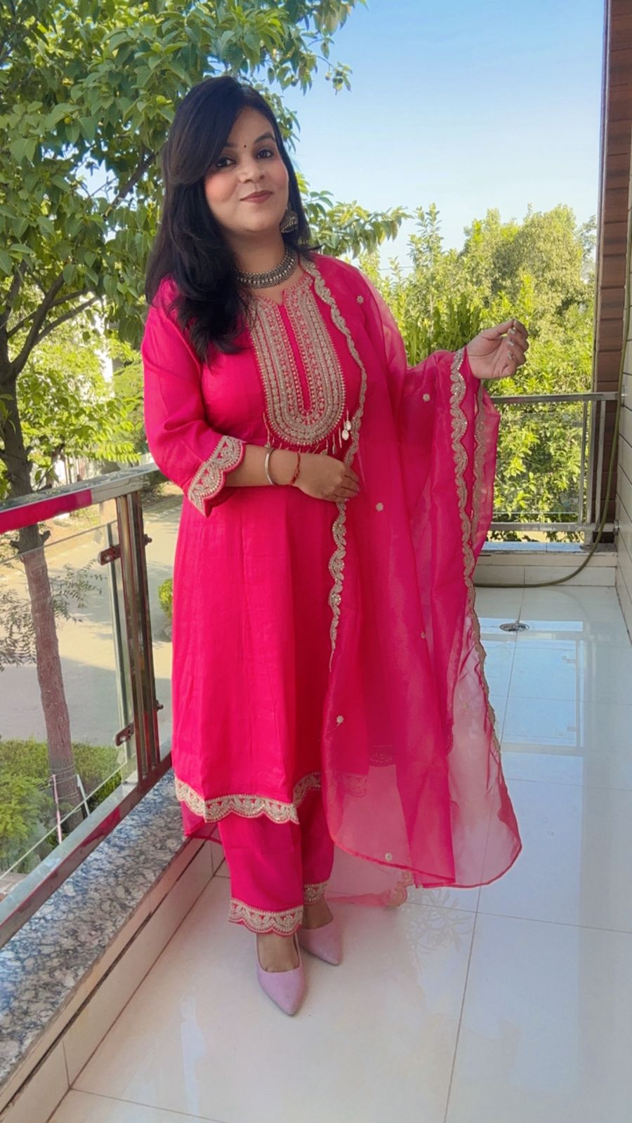 Pink Anarkali suit with golden embroidery