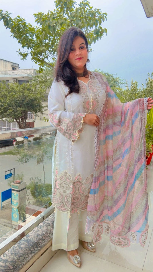 The Kameez (tunic) and Trousers are in a crisp Ivory or Off-White...