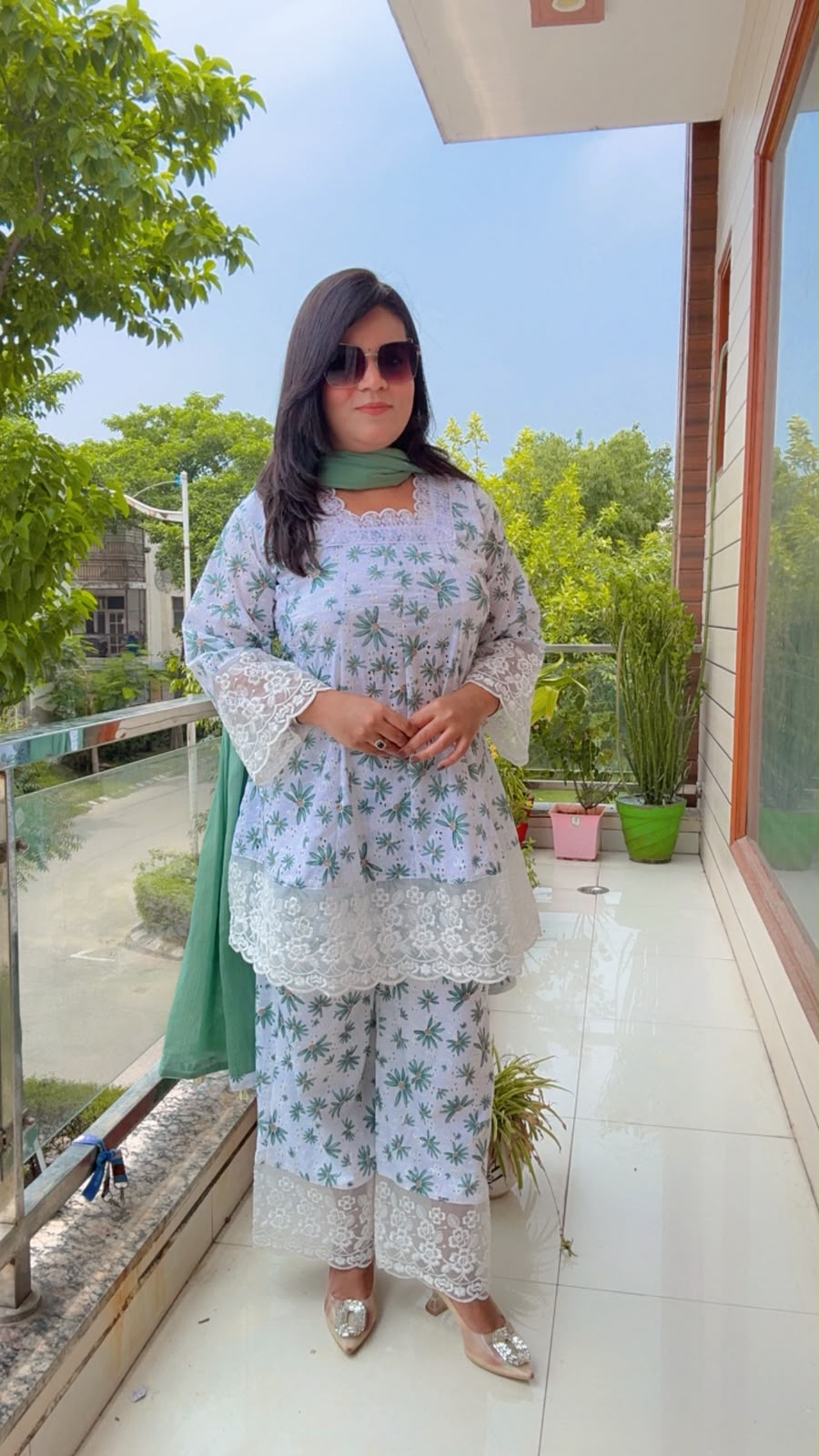 white schiffli cotton kurta with a botanical green print