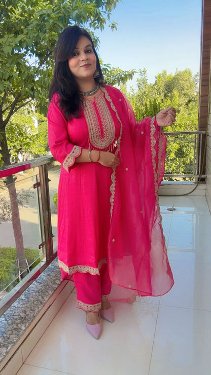 Pink Anarkali suit with golden embroidery