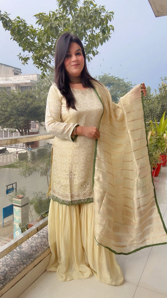 Elegant Ivory Sharara Set with Emerald Accents