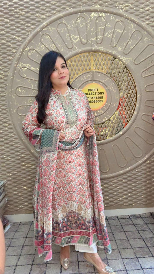 Floral printed Muslin suit set featuring detailed embroidery on the neckline.