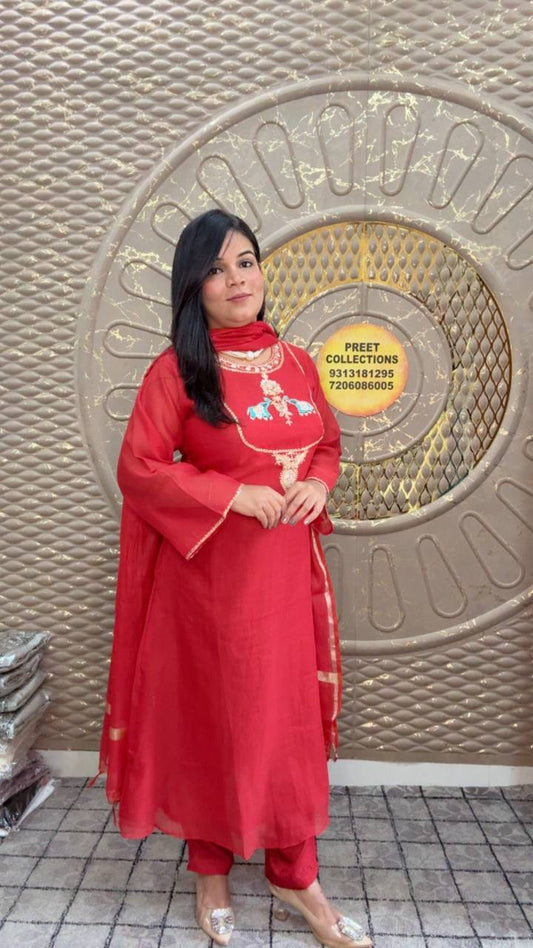 Red kurta set with embroidered elephant motifs and a sheer dupatta.