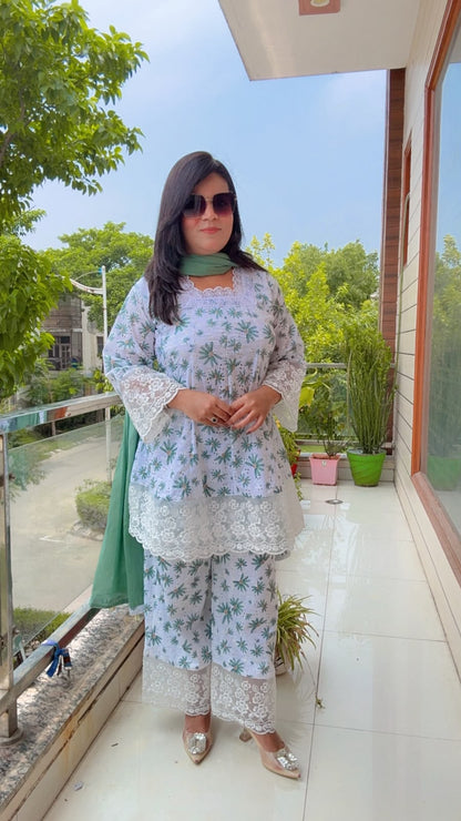 white schiffli cotton kurta with a botanical green print