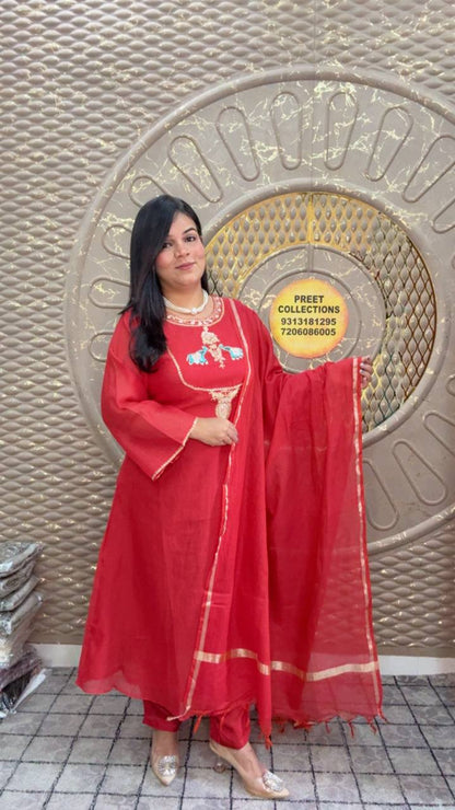 Red kurta set with embroidered elephant motifs and a sheer dupatta.